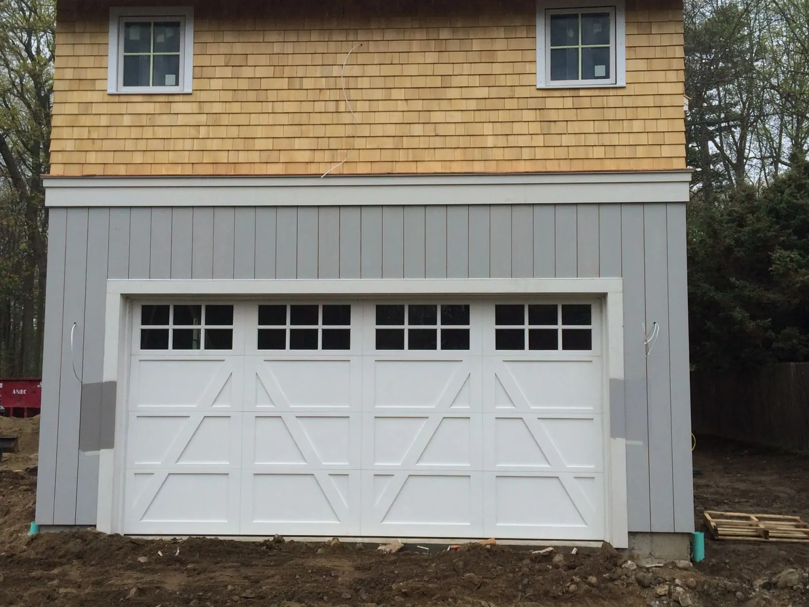 A carriage-house door with divided glass on a period home in Rye, NY